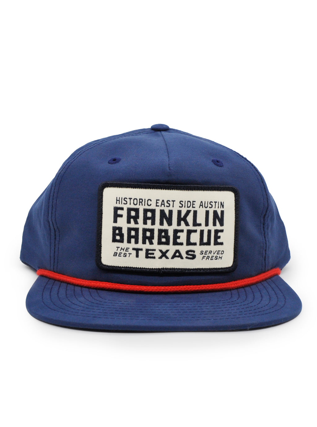 Navy blue baseball hat with a red band over the brim. A white, black bordered patch on the hat reads in black letters: "Historic East Side Austin Franklin Barbecue Texas. The Best. Served Fresh.
