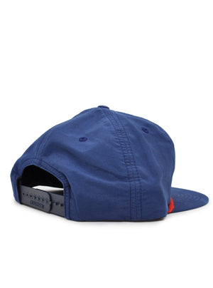 Back of a navy blue hat with an adjustable back.