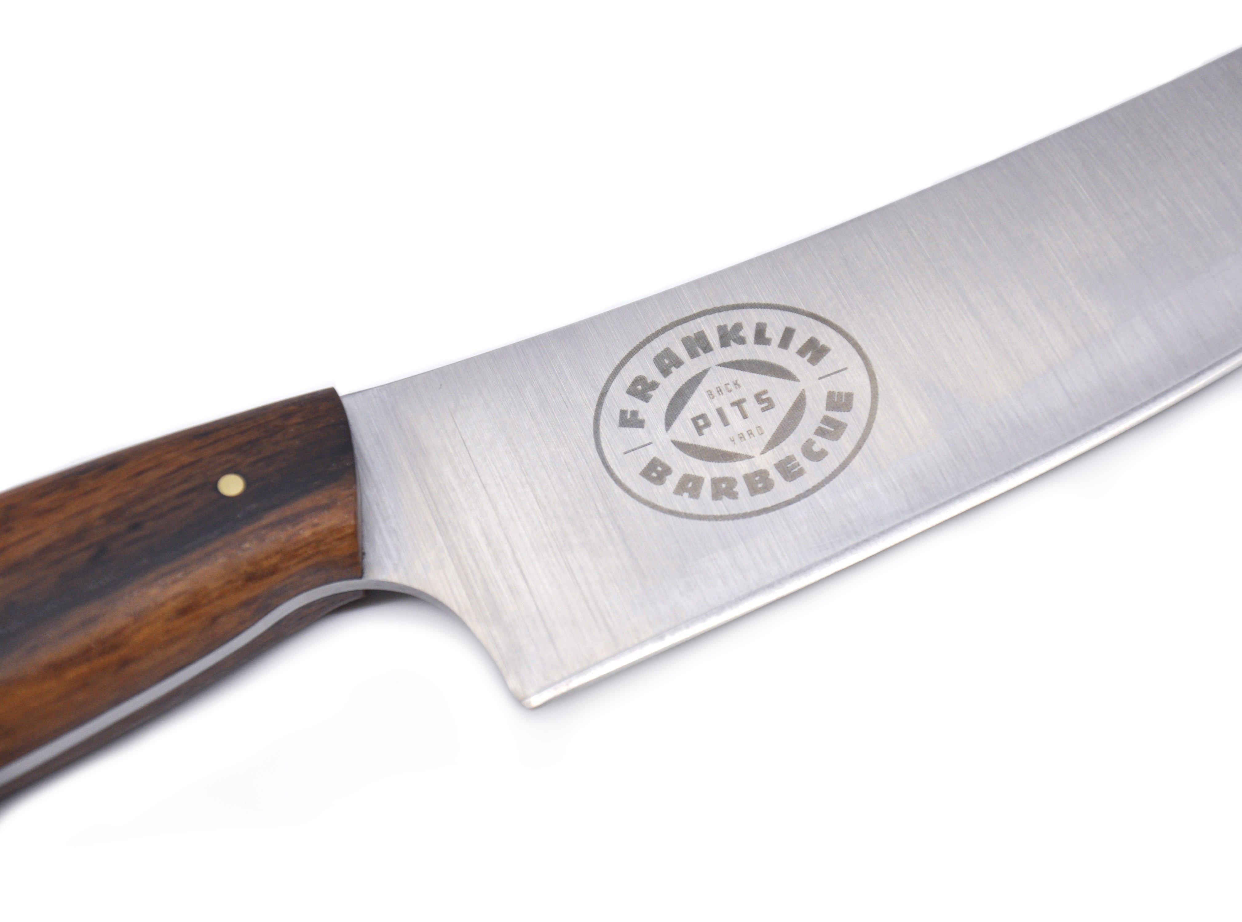 Close up on Franklin Barbecue Pits logo on the stainless steel blade of the Weige Trimming Knife 