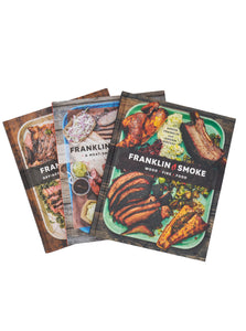 Image of Franklin Steak, Franklin Barbecue: A Meat Smoking Manifesto, and Franklin Smoke. Books trio are fanned outward