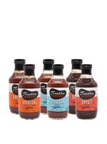 Set of Franklin Barbecue sauce bottles in various flavors on a white background