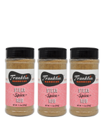 Three bottles of Franklin Barbecue Steak Spice Rub on a white background