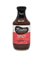 A bottle of Franklin Barbecue Spicy BBQ Sauce on a plain white background.
