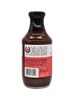 A bottle Franklin Barbecue Spicy BBQ Sauce, featuring a black cap and a white and red label with text and a barcode.