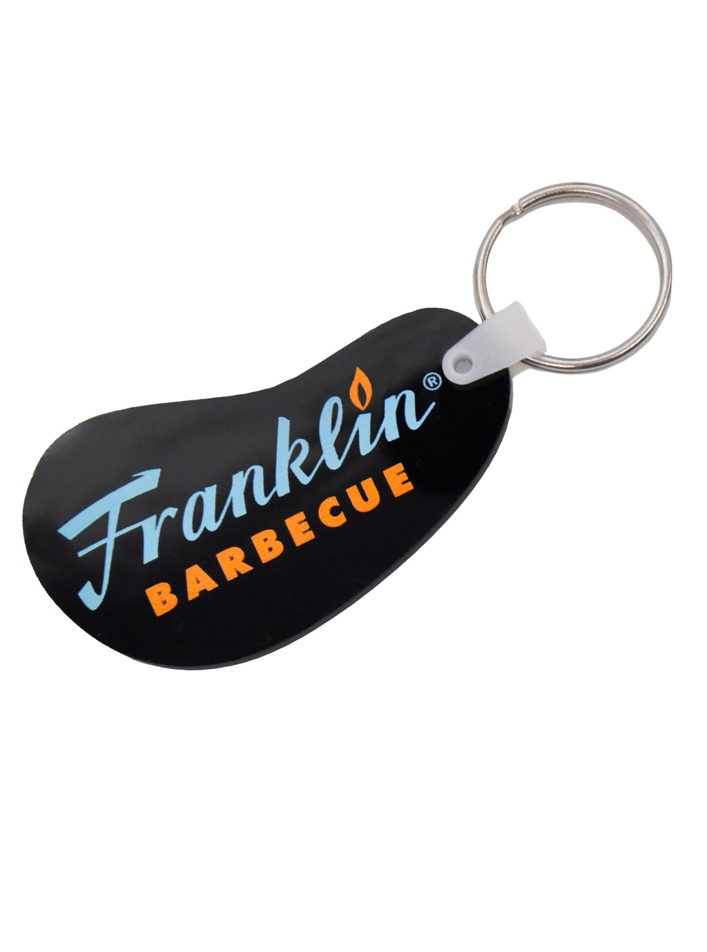 Black bean shaped vinyl keychain with blue and orange Franklin Barbecue logo. A silver metal key ring on the right side.
