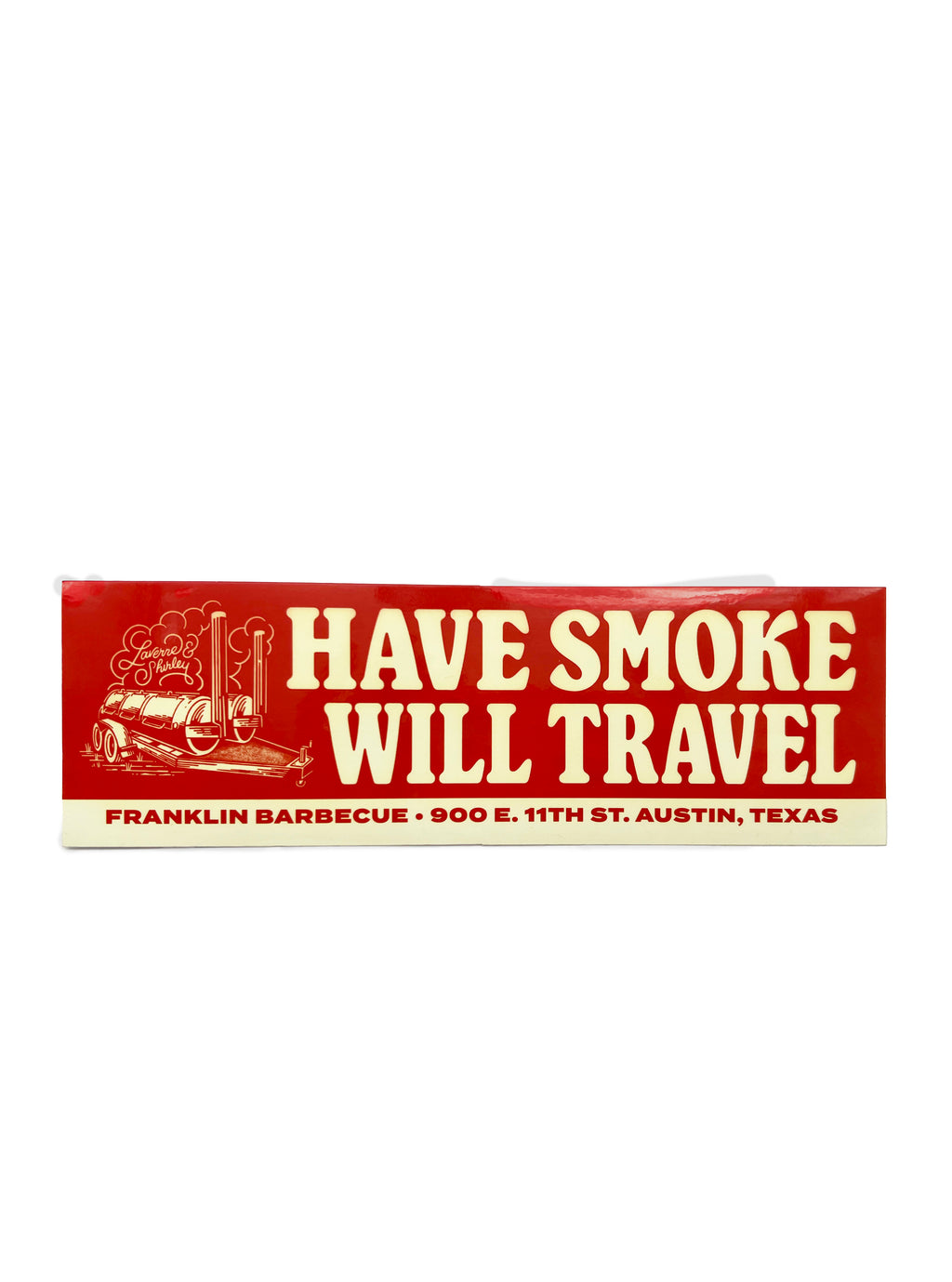 Red and cream colored bumper sticker that says in big letters "HAVE SMOKE WILL TRAVEL". To the left of the words is a drawing of  two barbecue smokers. Across the bottom of the sticker it says in smaller letters: "Franklin Barbecue. 900 E. 11th St. Austin, TX".