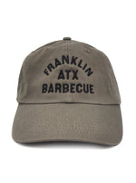 Olive color soft dad hat with FRANKLIN ATX BARBECUE black stitching in all caps.