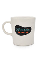 Thick white mug featuring the Franklin logo.