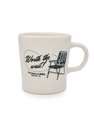 Thick white mug featuring a picture of a lawn chair with "Worth the Wait!" written next to it.