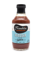 18 oz glass bottle of a dark red Vinegar BBQ Sauce.