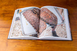 Interior page spread of Franklin Barbecue: A Meat-Smoking Manifesto showing a smoked rack of ribs.