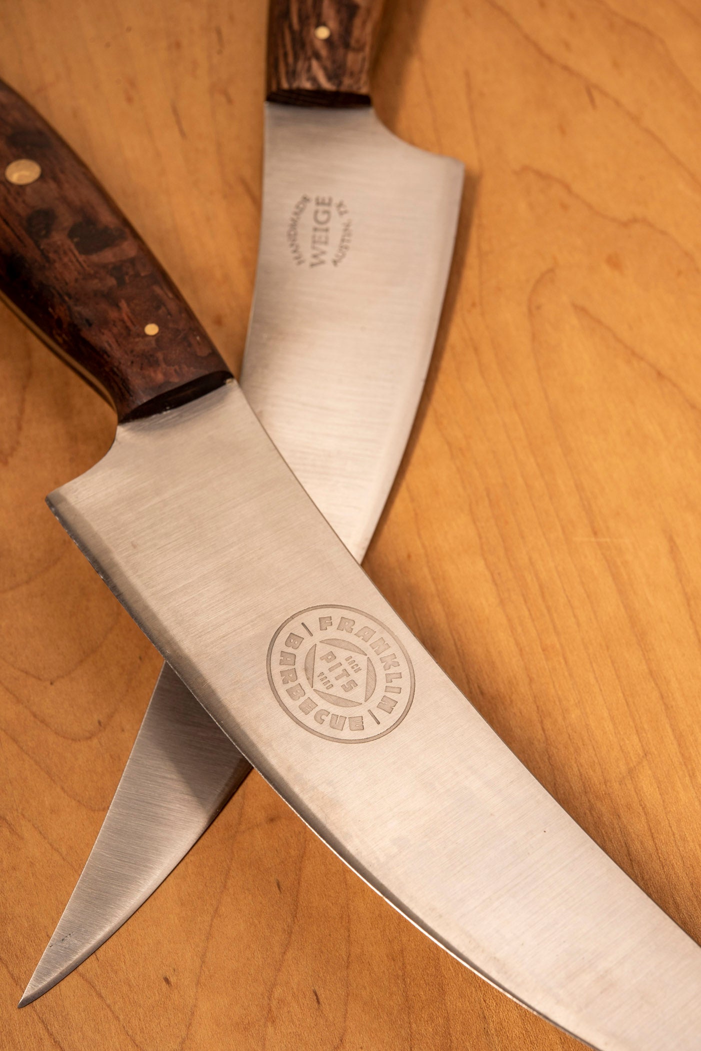 Two Franklin Barbecue Pits Weige Trimming Knives laid criss-crossed 