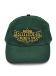 Dark green hat with logo saying "Registered Franklin Barbecue Pits Austin U.S.A." in yellow