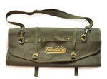 Green Franklin Barbecue PIts knife roll with stitched logo saying "Franklin Barbecue Pits" in gold thread
