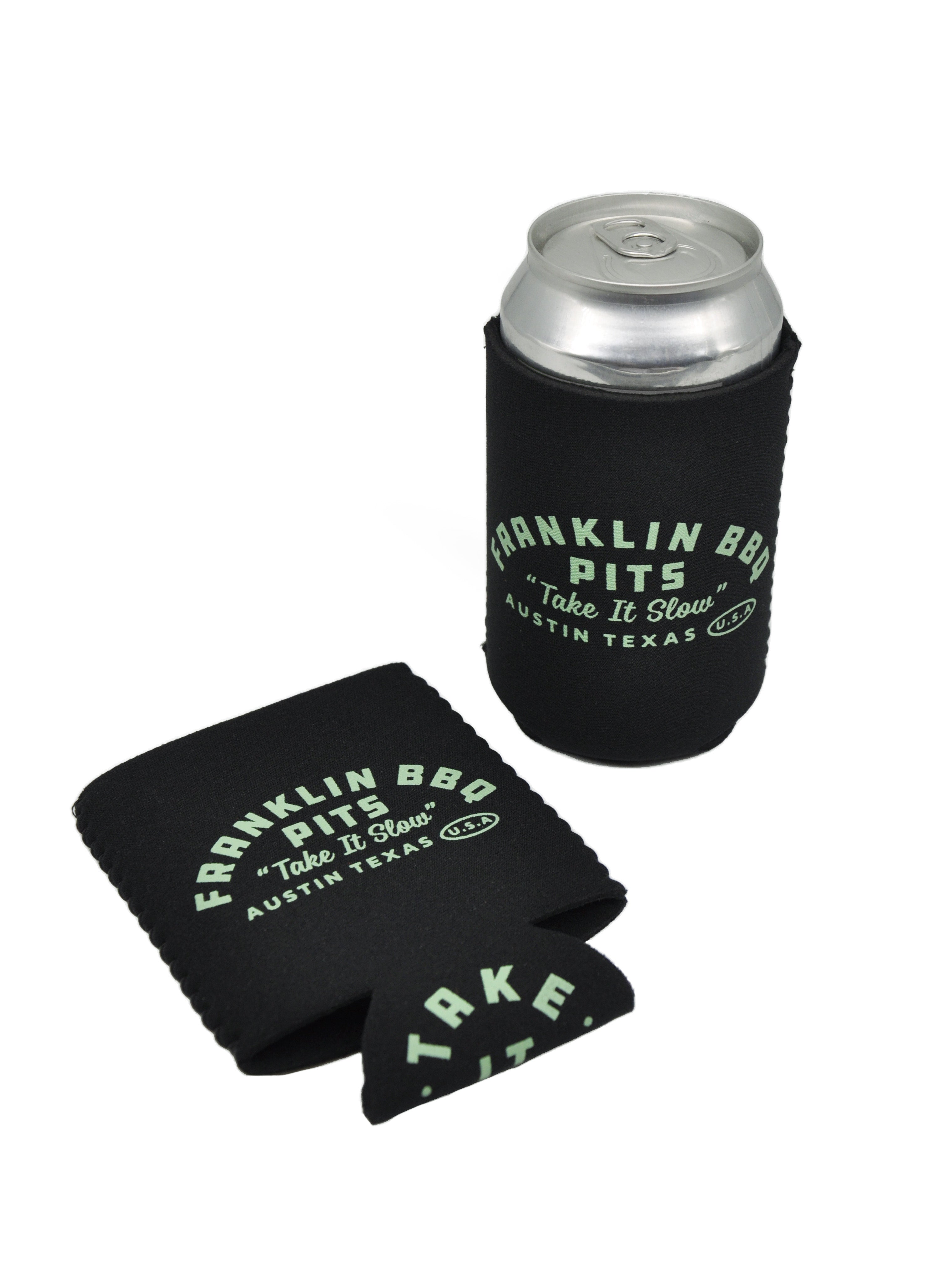Black beer hugger that reads "Franklin BBQ Pits 'Take it Slow' with Austin, Texas below. Underside of beer hugger reads TAKE IT SLOW