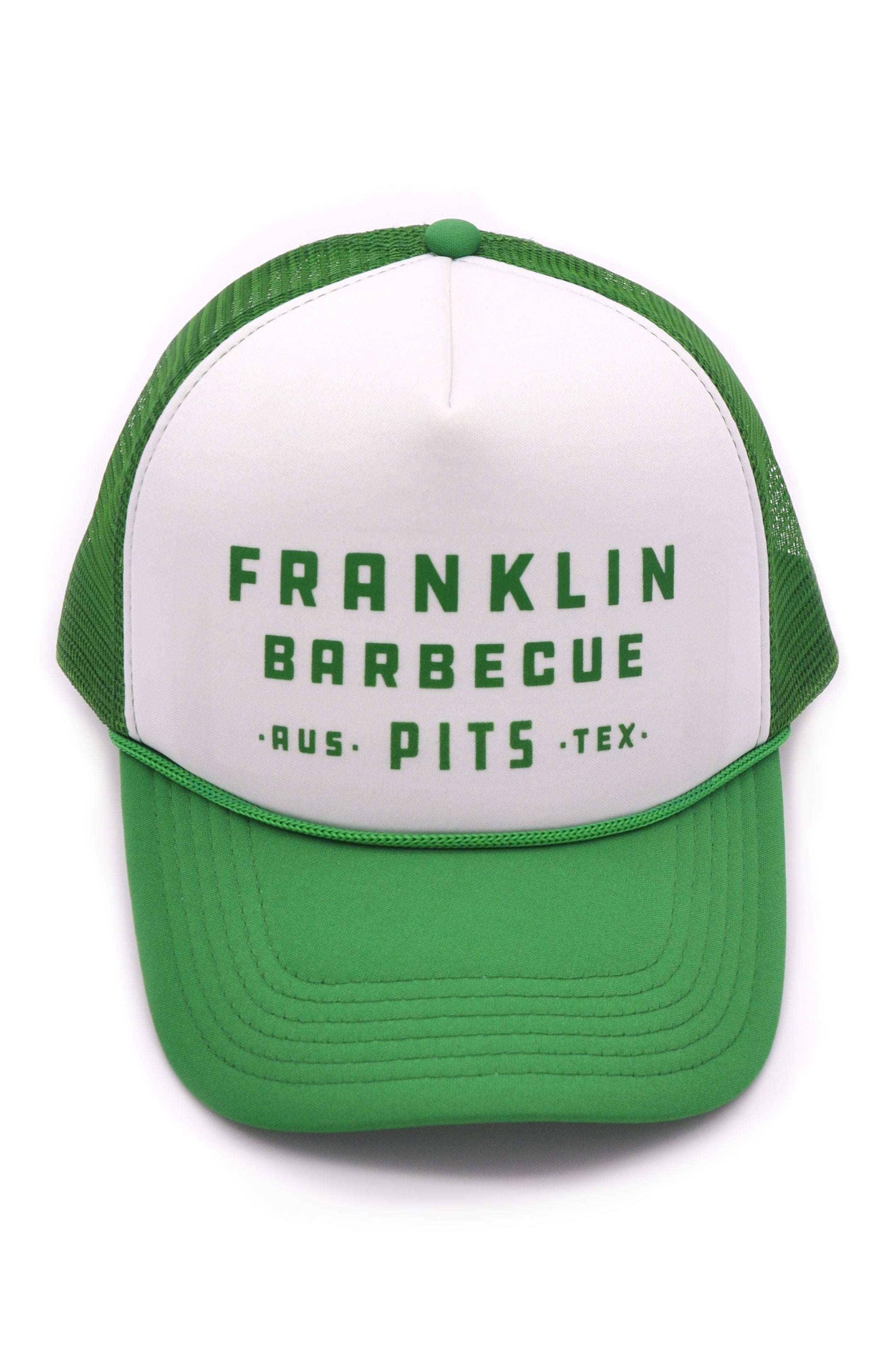 Franklin BBQ Pits Trucker Hat with green bill and mesh backing. Logo says "Franklin Barbecue Pits Aus Tex" in green lettering against a white background