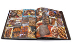 Interior photo spread of Wyatt McSpadden's book Texas BBQ Small Town to Downtown. Image shows a variety of smoked meats from different restaurants.