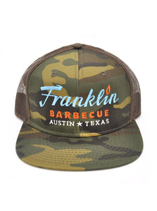 Camouflage cap with brown mesh sides. Franklin Barbecue text logo in blue and orange. Below that is Austin Texas in white. Image also states Free Shipping USA