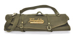 Green Franklin Barbecue PIts knife roll with stitched logo saying "Franklin Barbecue Pits" in gold thread
