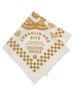 Folded tan Franklin BBQ Pits bandana. Dimensions are 22’ x 22”