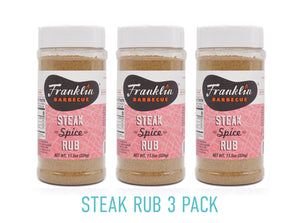 11.5 oz Steak Rub 3 pack with pink label and Franklin Barbecue bean logo in black with white and orange lettering