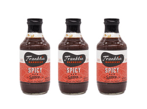 Trio of Franklin Barbecue Spicy Sauce bottles.