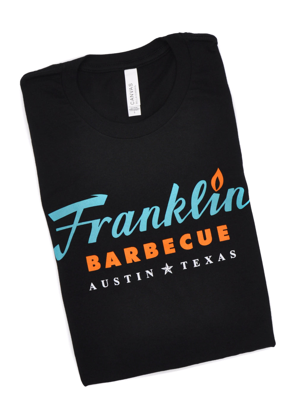 Black t-shirt with Franklin Barbecue text logo in blue and orange. Below that is Austin Texas in white.
