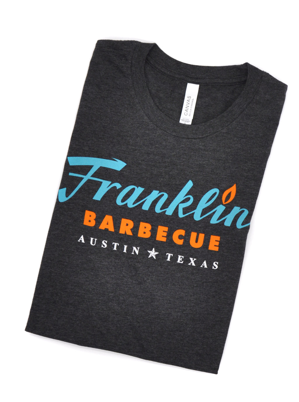 Grey t-shirt with Franklin Barbecue text logo in blue and orange. Below that is Austin Texas in white.
